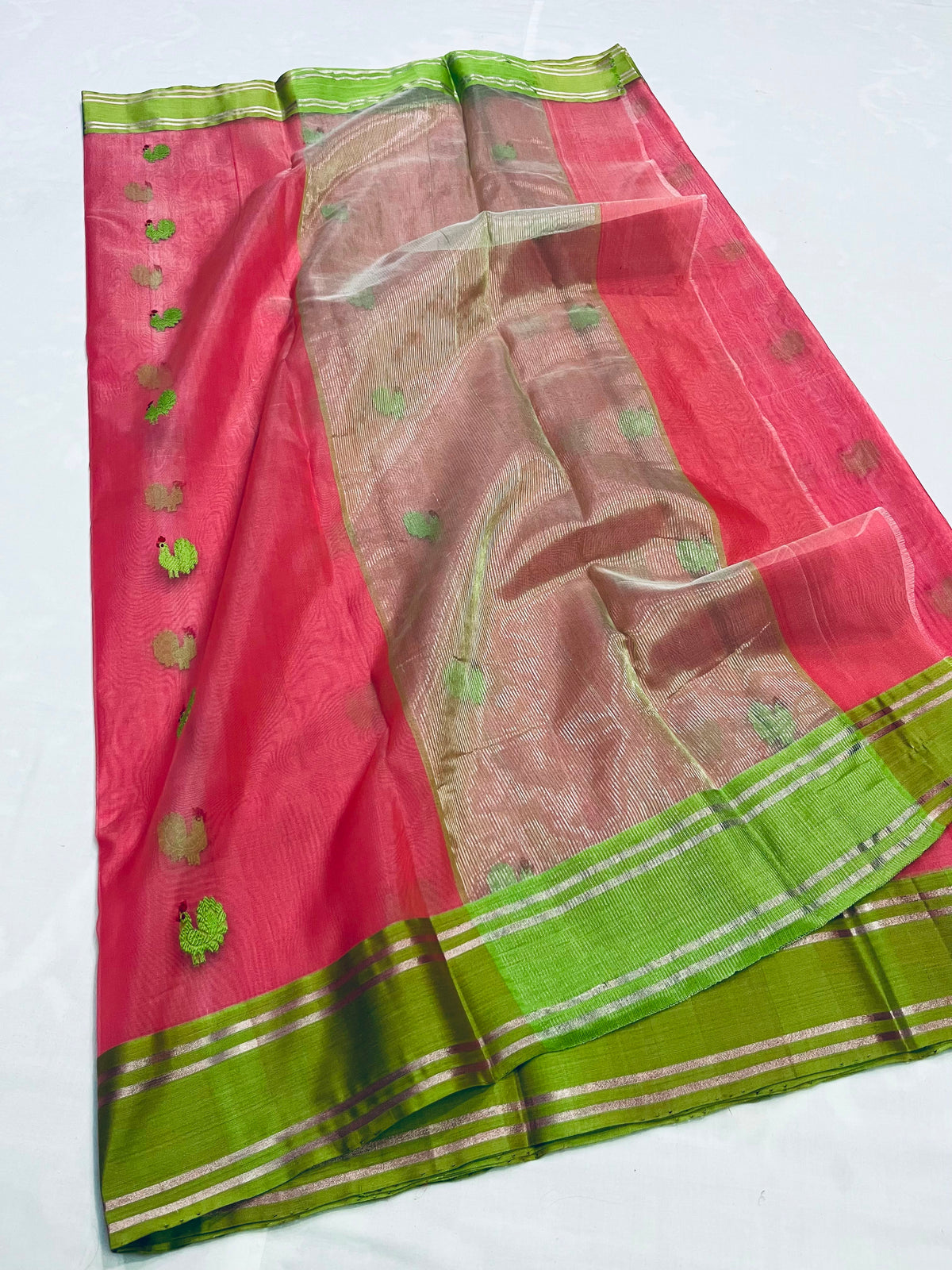Parrot green bird motifs on coral pink silk Chanderi saree