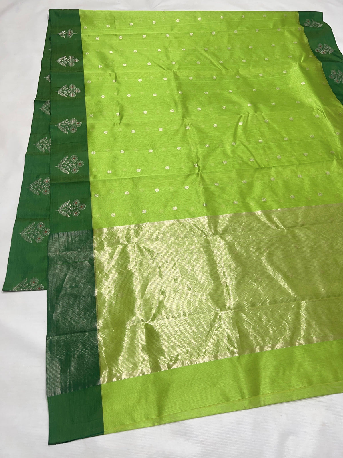 Parrot Green handloom Pattu Silk Chanderi saree with silver buttas and Deep Forest Green floral border