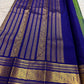 Gold zari detail on parrot green Kanchipuram pure silk