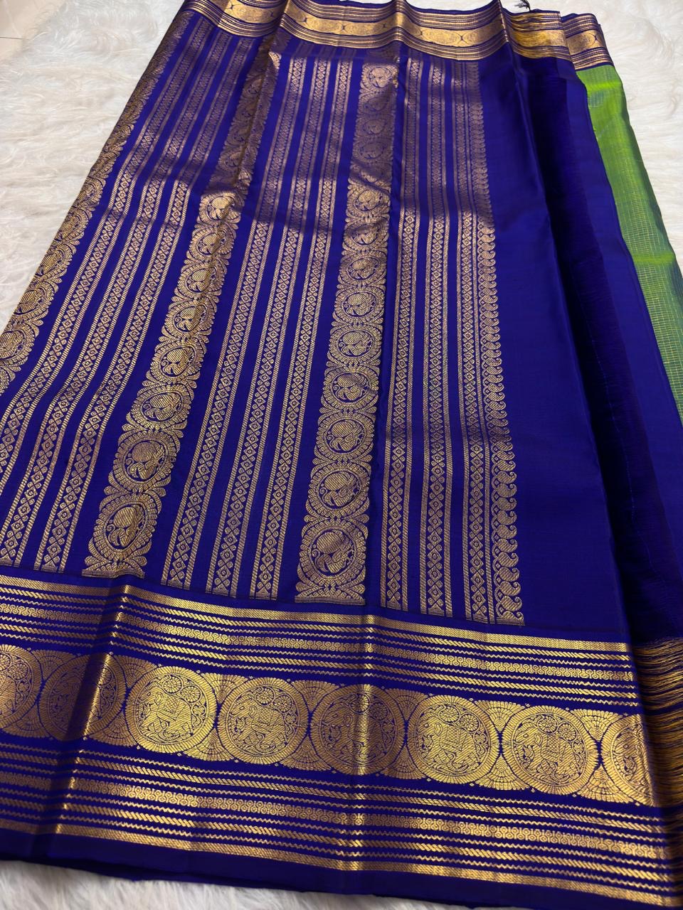 Gold zari detail on parrot green Kanchipuram pure silk