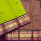 Folded Parrot Green Pure Silk Kanchipuram Korvai saree with multicoloured silk-thread buttas and Deep Purple Mayil zari border.