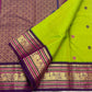 Open Parrot Green Pure Silk Korvai saree with Deep Purple border, gold Mayil motifs and richly woven zari pallu.