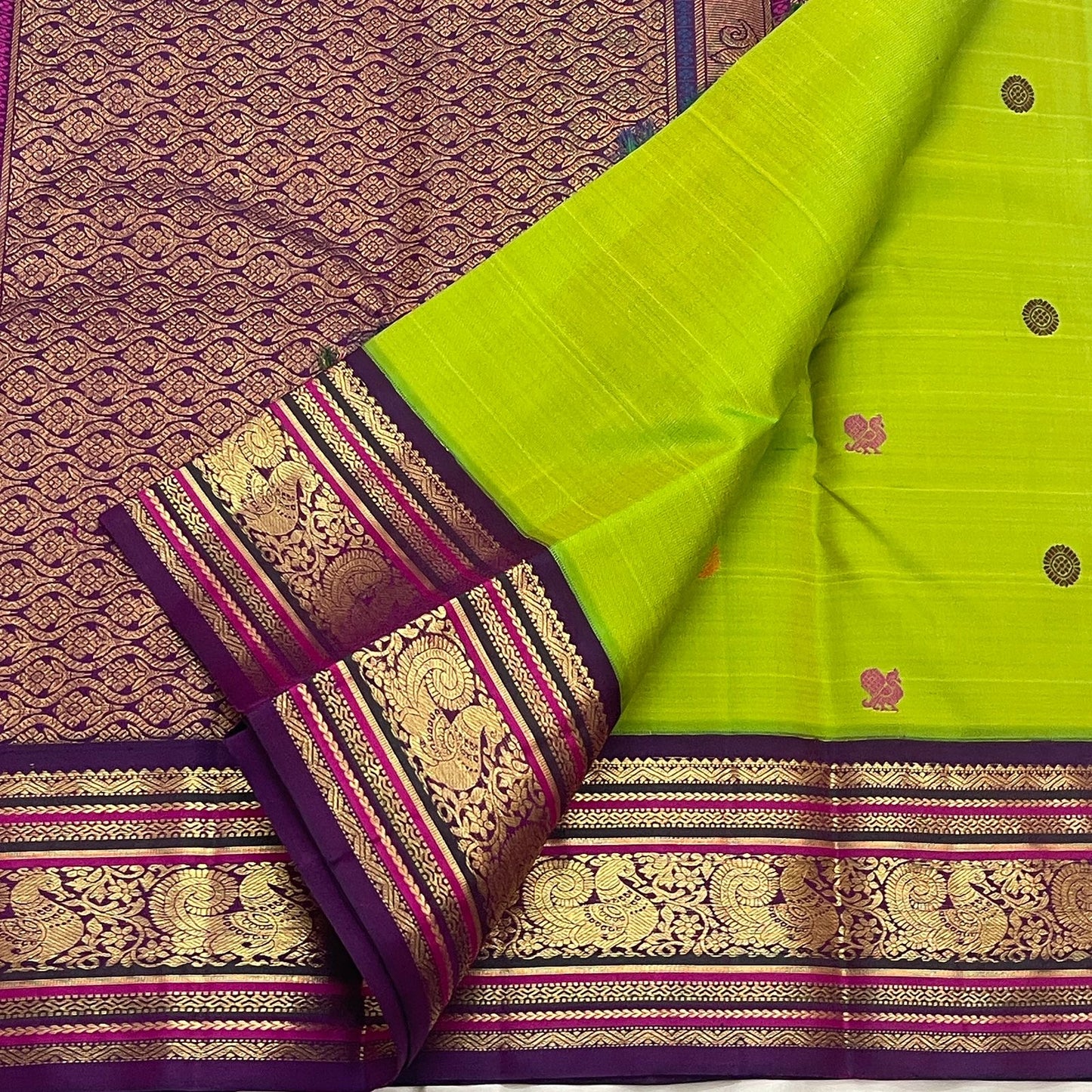 Open Parrot Green Pure Silk Korvai saree with Deep Purple border, gold Mayil motifs and richly woven zari pallu.