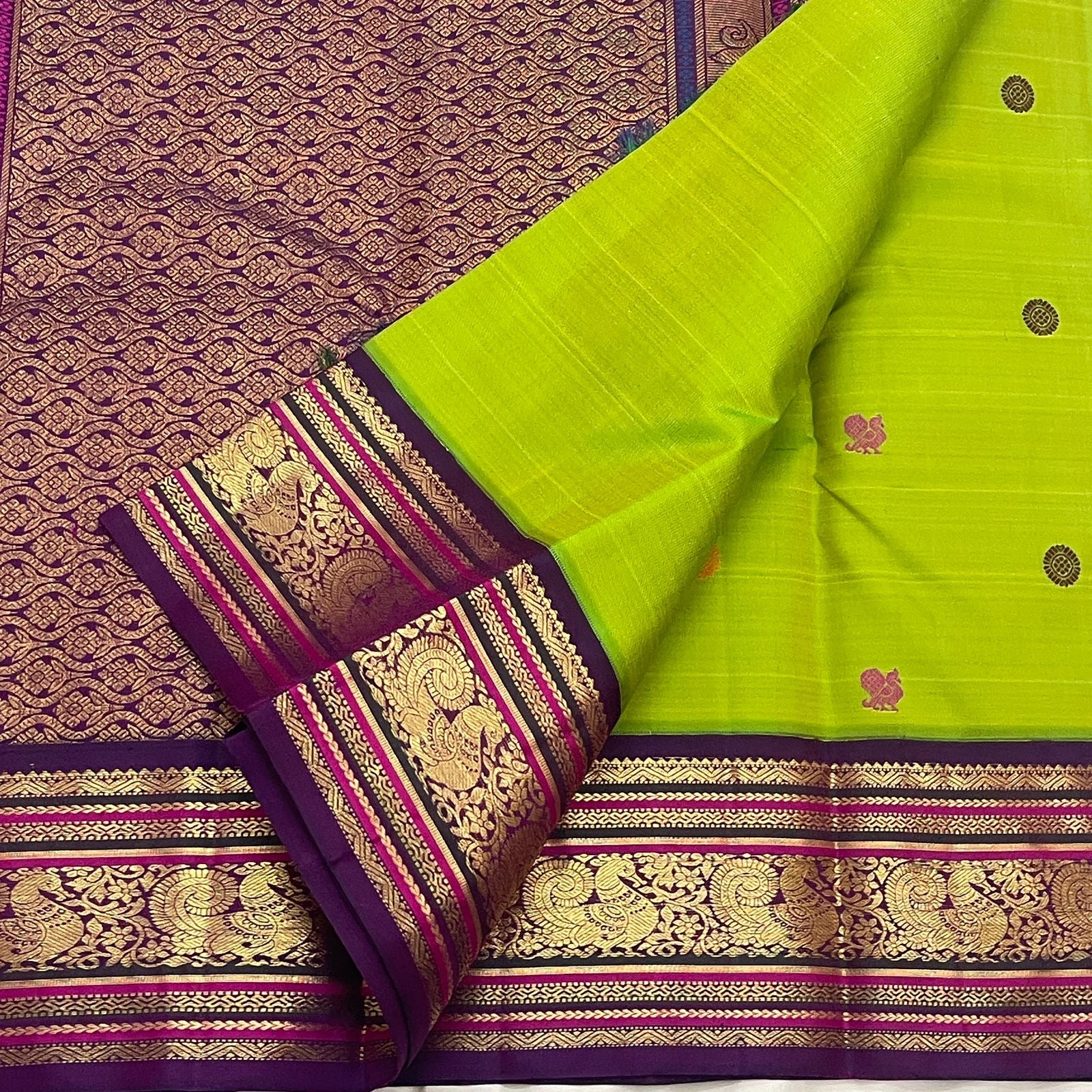 Open Parrot Green Pure Silk Korvai saree with Deep Purple border, gold Mayil motifs and richly woven zari pallu.