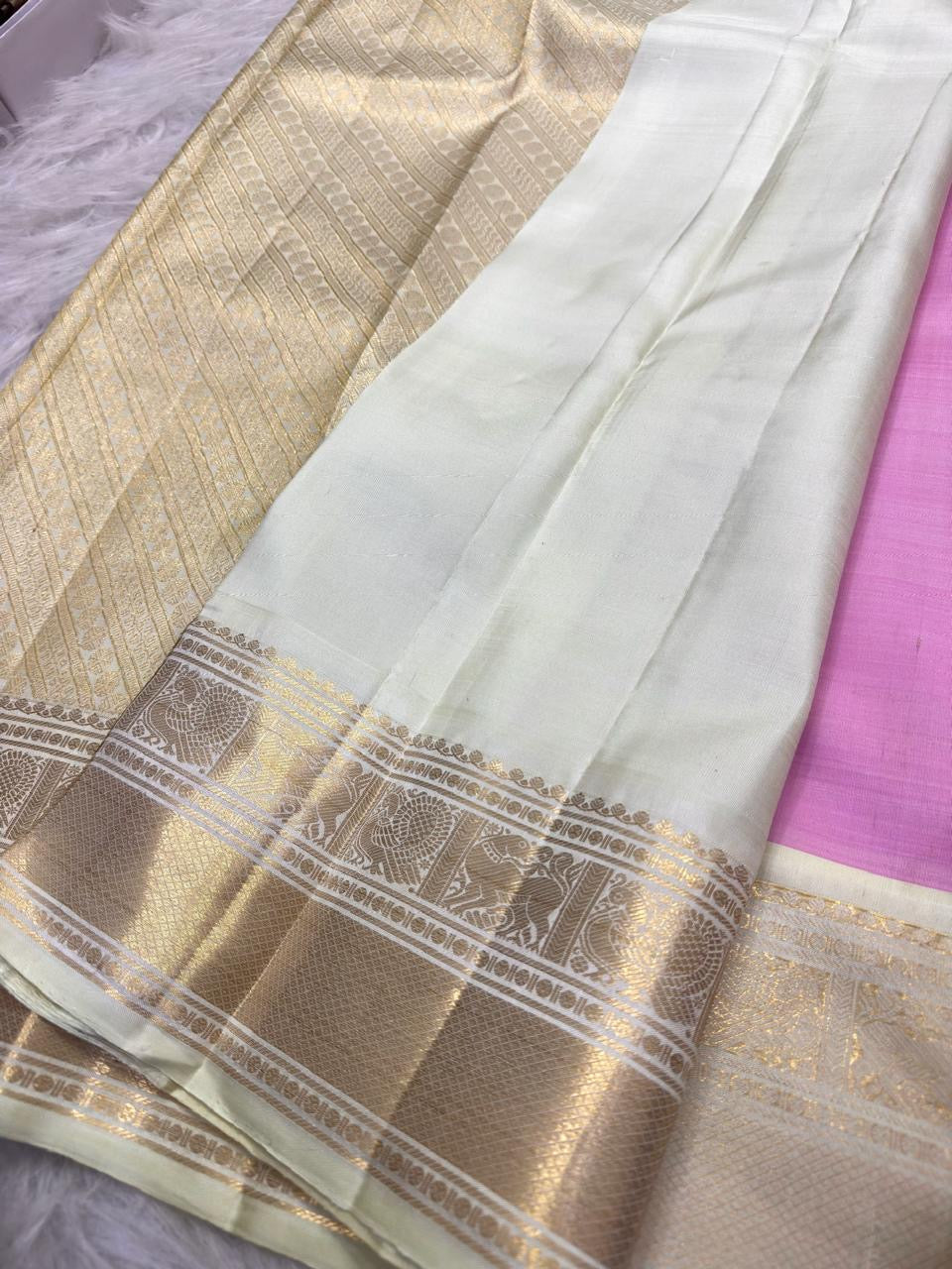 Cream ivory contrast border on pastel pink silk saree