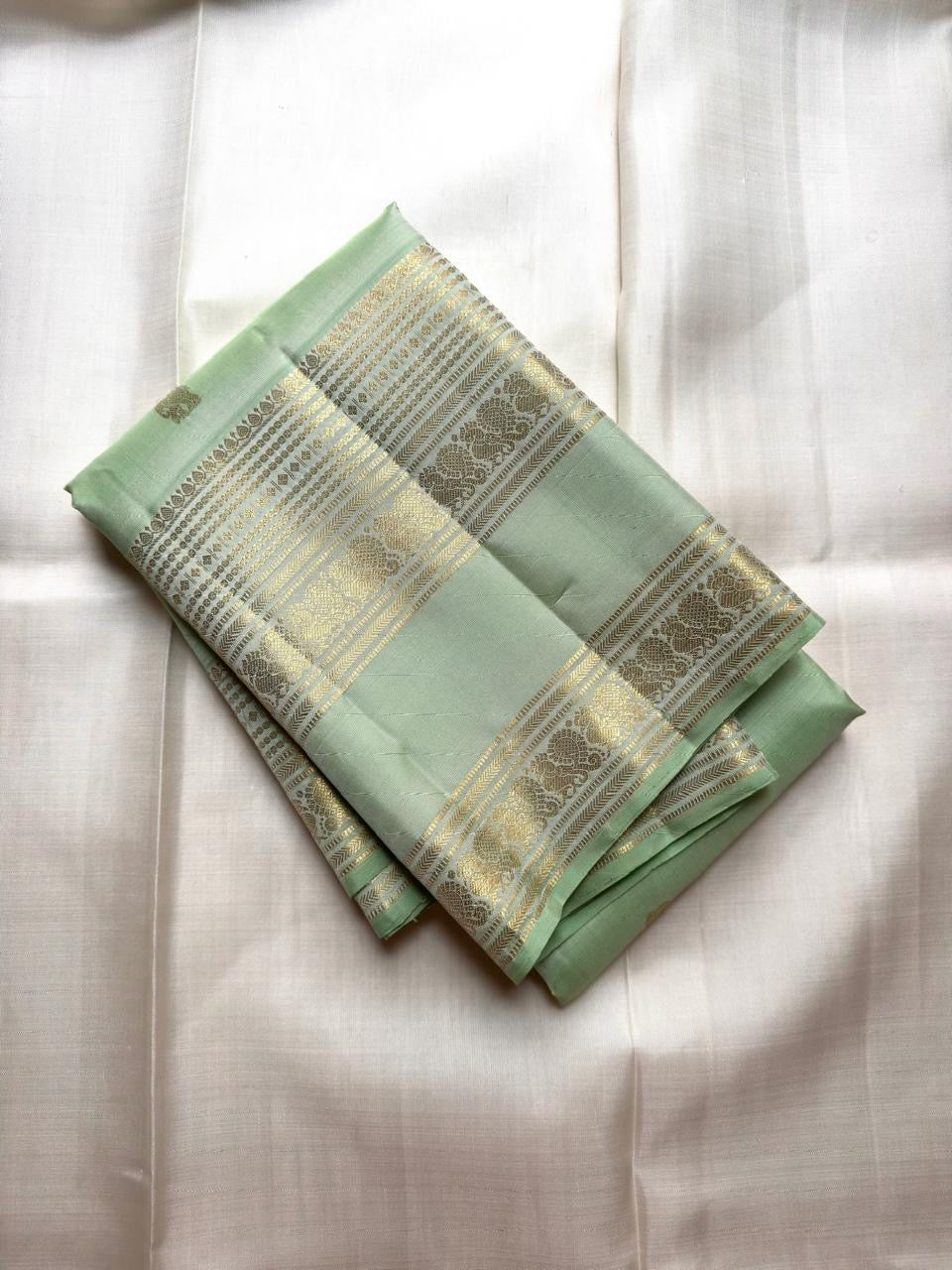 Pastel Mint Green Kancheepuram silk saree draped, full length view — Idam Living