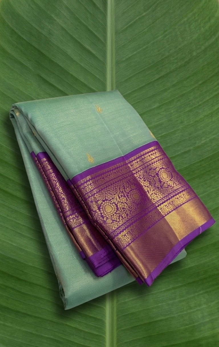 Pastel Mint Green and Royal Orchid Purple Handwoven Pure Silk Kanchipuram Saree with Vairaoosi Korvai Border and Mayil Chakram Butta