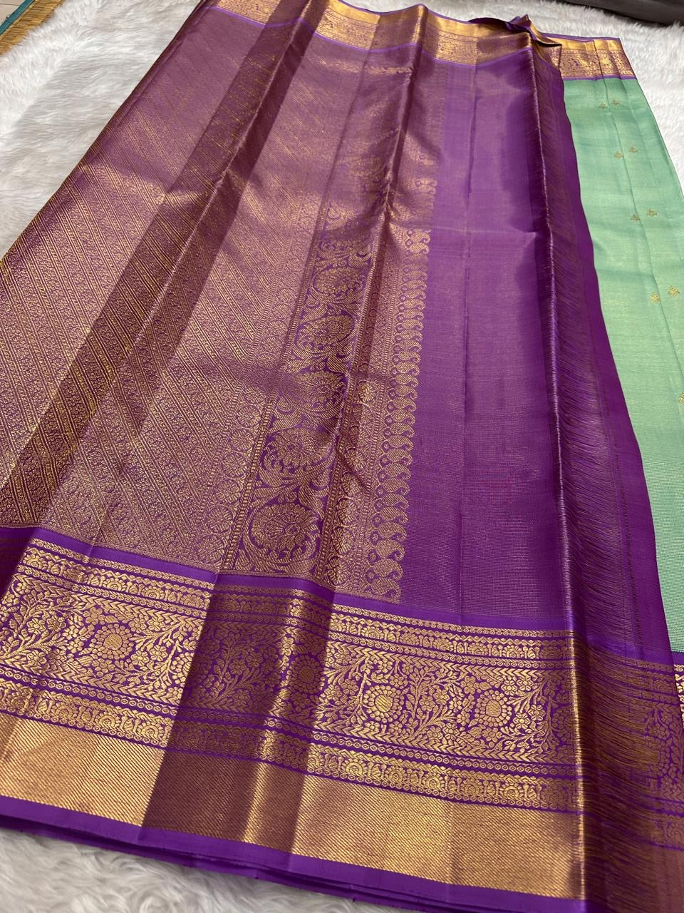 Pastel Mint Green and Royal Orchid Purple Handwoven Pure Silk Kanchipuram Saree with Vairaoosi Korvai Border and Mayil Chakram Butta