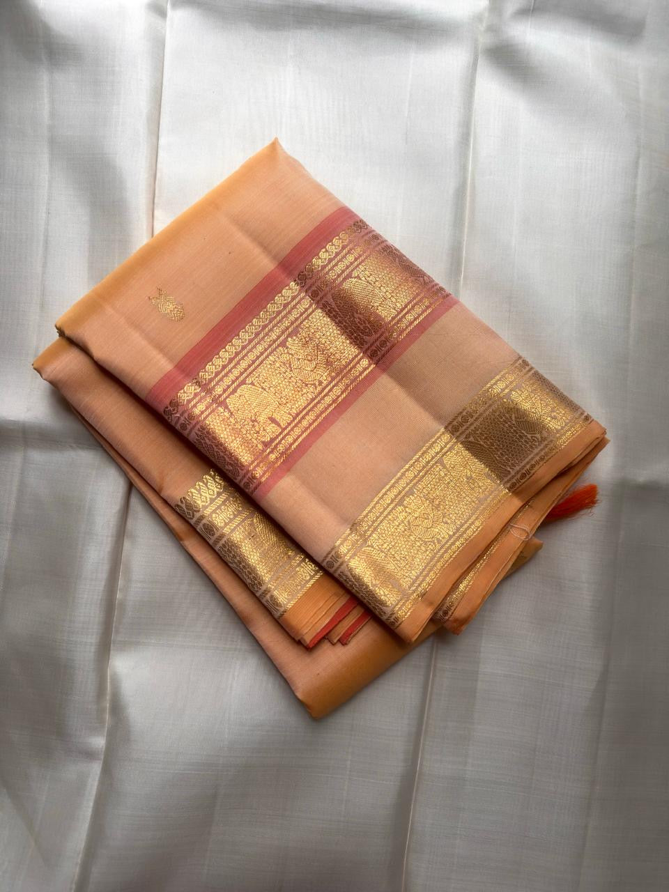 Pastel Peach Kanjeevaram silk saree, gold zari butta motif close-up — Idam Living