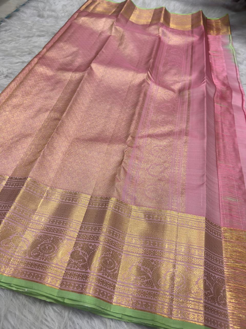 Pastel pink Kancheepuram saree with Pistachio Green contrast