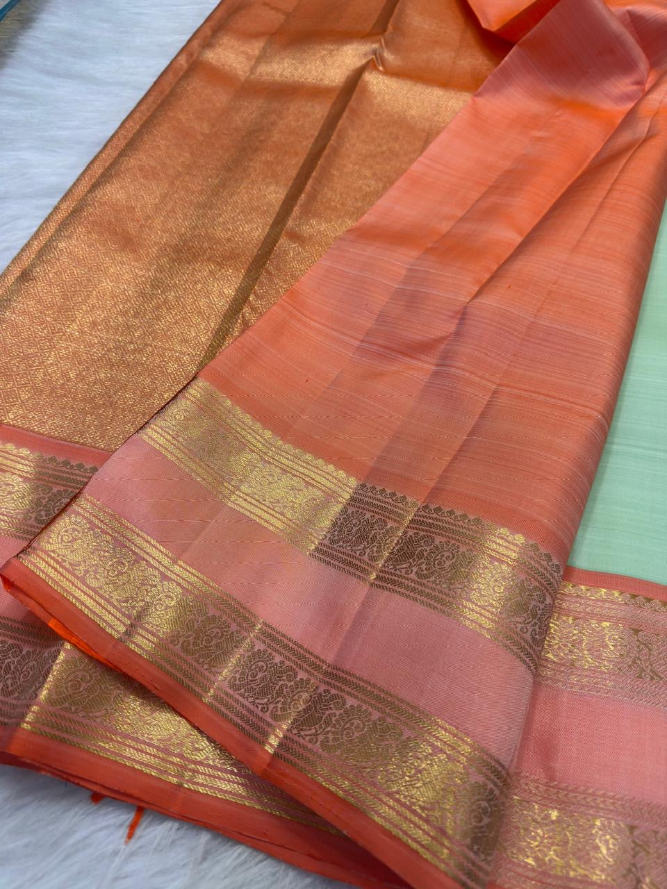 Pastel Pistachio Green Pure Silk Kancheepuram Rettapet Saree - peach-orange double-shade border front view