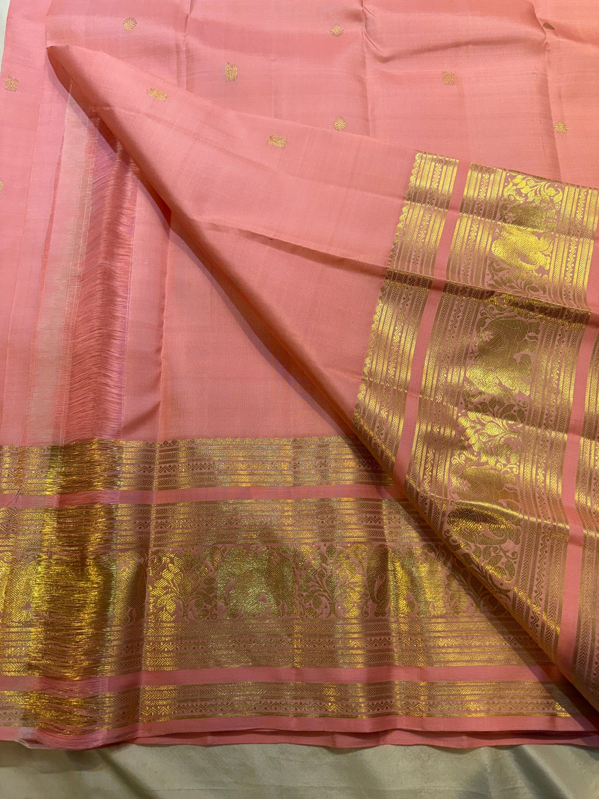 Pattu Roja pink Kanchipuram silk Butta saree with gold zari buttas, draped