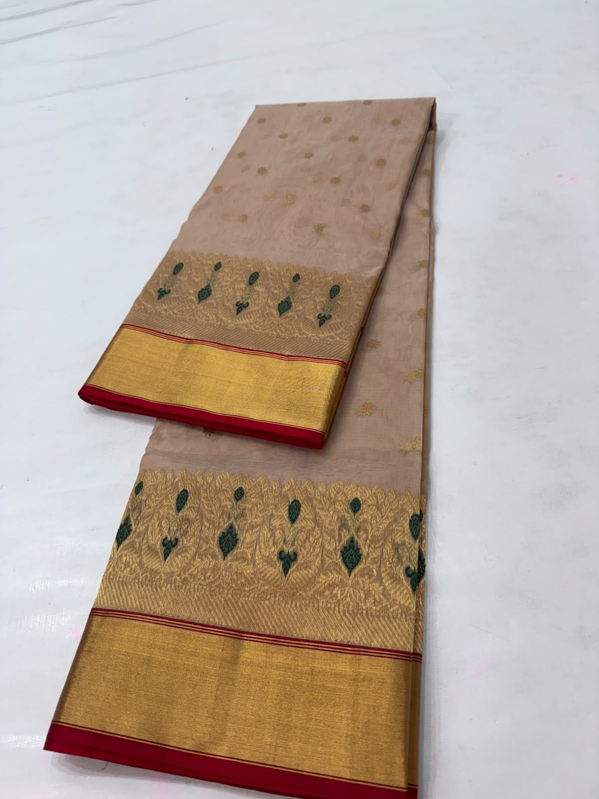 Ornamental woven border on champagne-beige Chanderi
