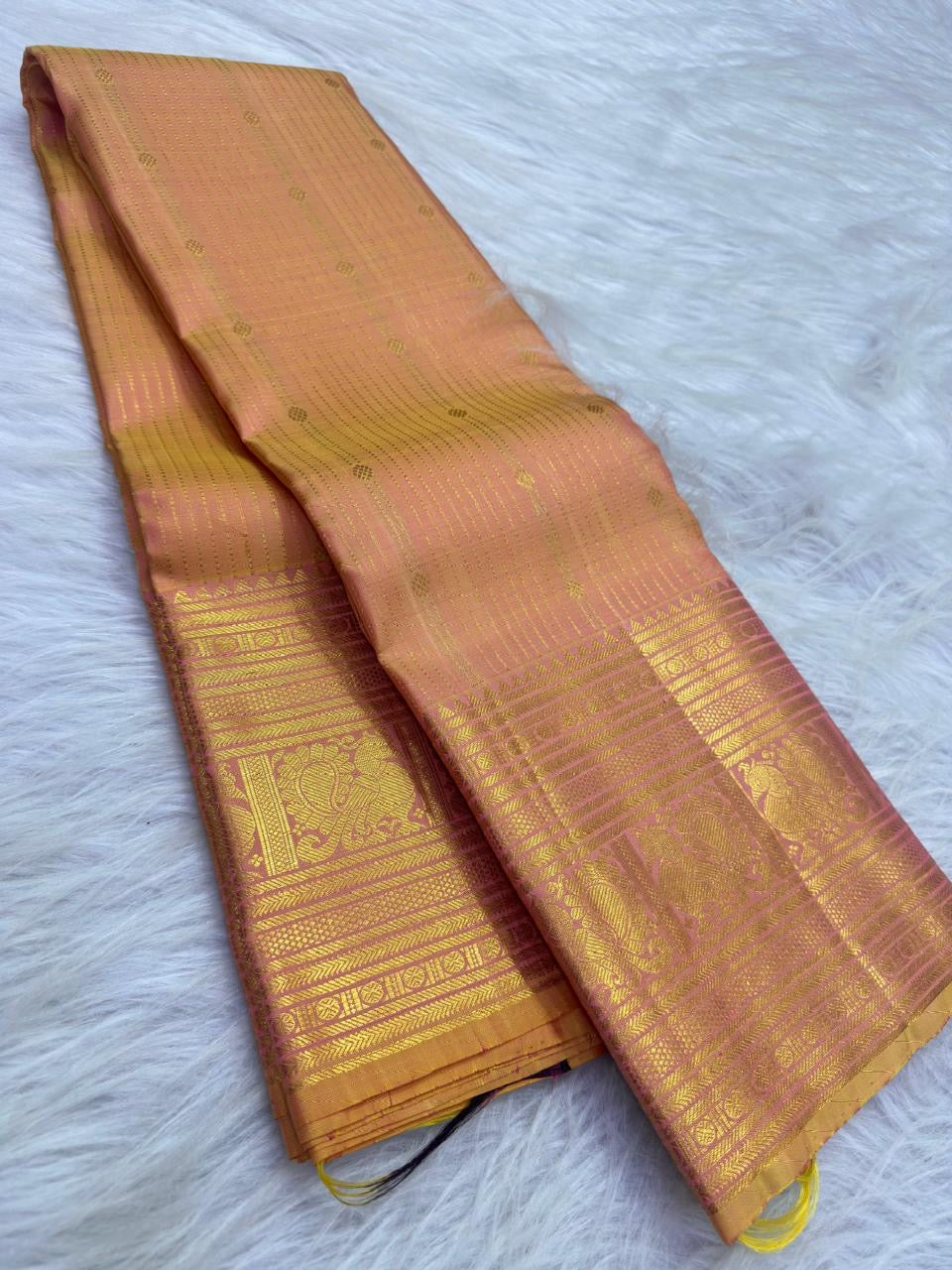 Peach Gold pure silk KanchiPattu Butta saree with Antique Rose warm gold zari border.
