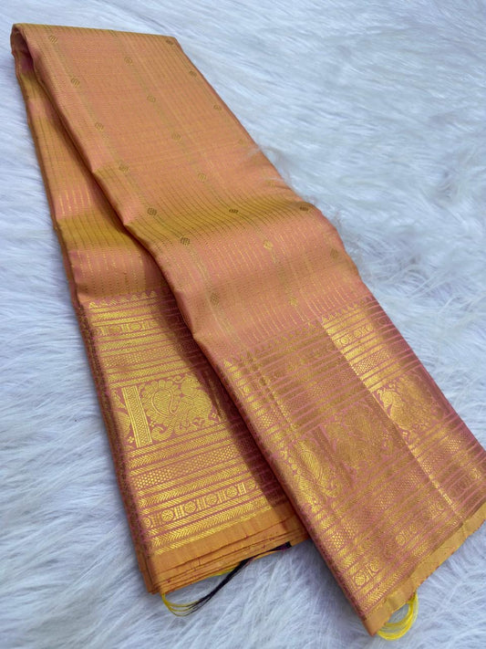 Peach Gold pure silk KanchiPattu Butta saree with Antique Rose warm gold zari border.