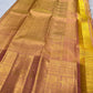 Peach Gold pure mulberry silk saree with delicate zari lines and traditional gold buttas.