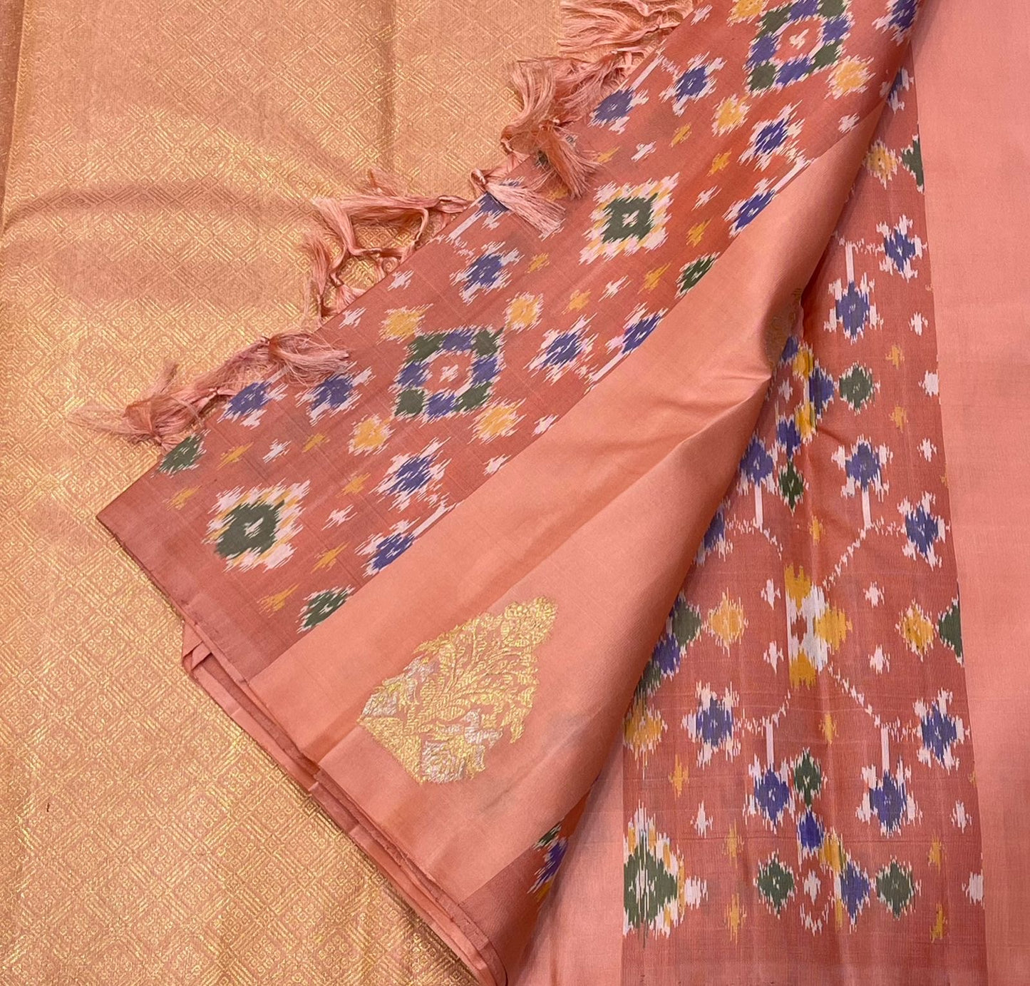 Folded view of peach and peach pink pochampally ikat Kanjeevaram silk saree — Idam Living