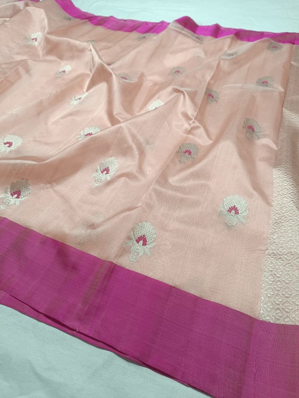Blush Peach handloom Pattu Silk Chanderi saree draped to show the soft peach-pink tone and natural silk sheen