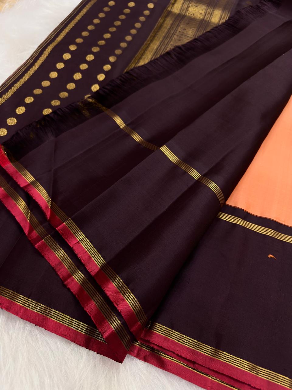 Soft Peach Pink Handwoven Pure Silk Kanchi Pattu Saree with Deep Aubergine Rettapet Border and Zari Buttas