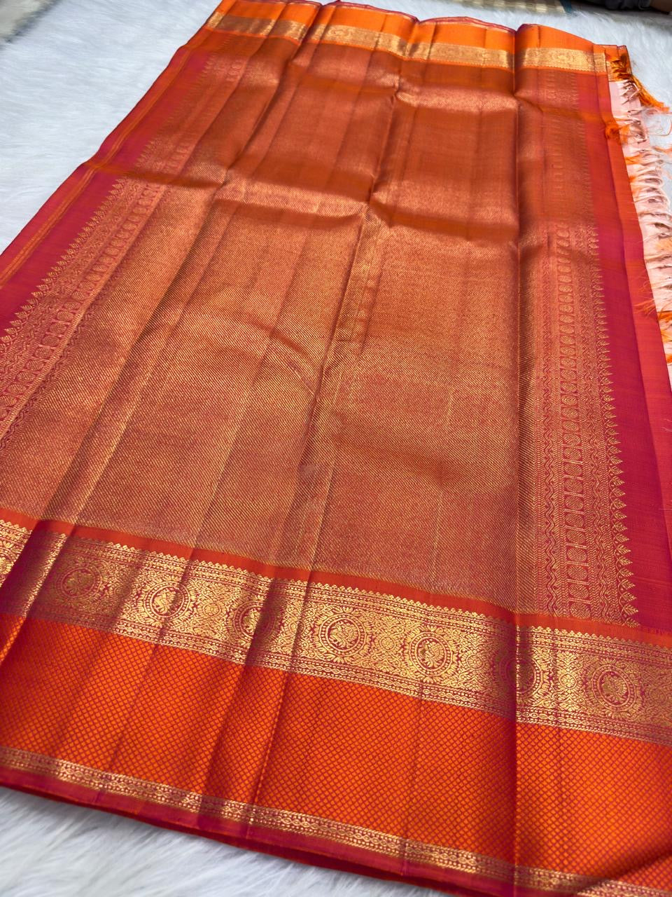 Soft peach pink Kanjipuram Korvai saree, close drape view