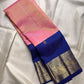 Peach pink tissue Kanjeevaram Butta saree with royal blue Yaanai zari border