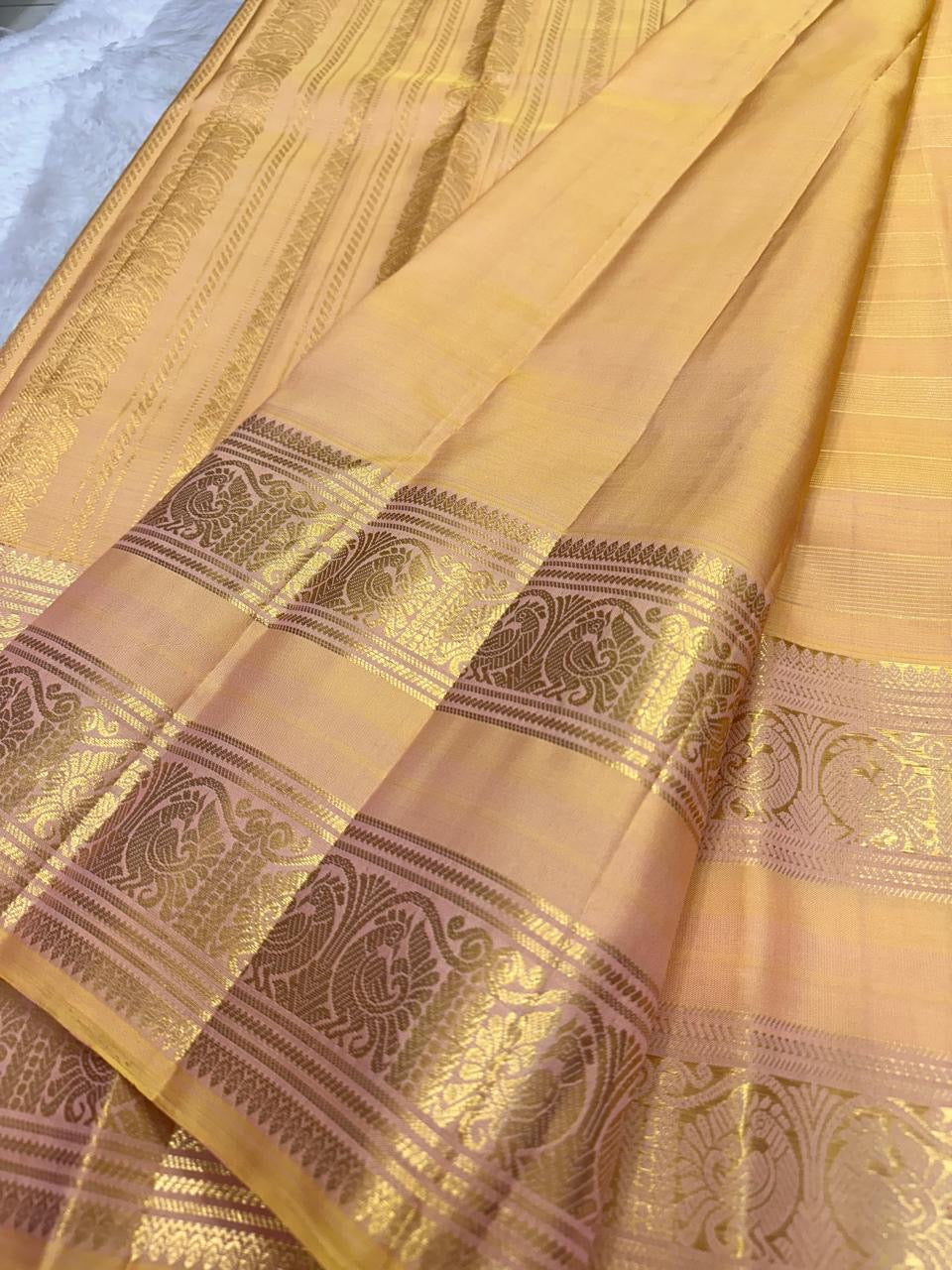 Peach Handwoven Pure Silk Kancheepuram Saree with Rettapet and Peacock Border