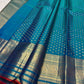 Deep Sapphire Blue Kanchipuram Butta saree with rich gold border and narrow Red selvedge.