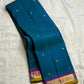 Close-up of Kamalam Butta gold-zari motifs on peacock blue Kancheepuram silk body
