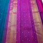 Magenta petite border with fine gold zari edge on peacock blue Kancheepuram saree