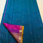Peacock blue Butta Kancheepuram silk saree folded, showing full drape and border
