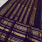 Peacock blue Kanjivaram silk body close-up showing petite mayil chakram butta motifs
