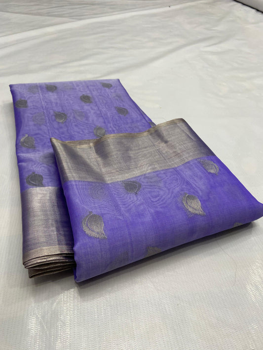 Amethyst lavender Chanderi saree folded to show the silver-toned paisley buttas and broad silver-grey border