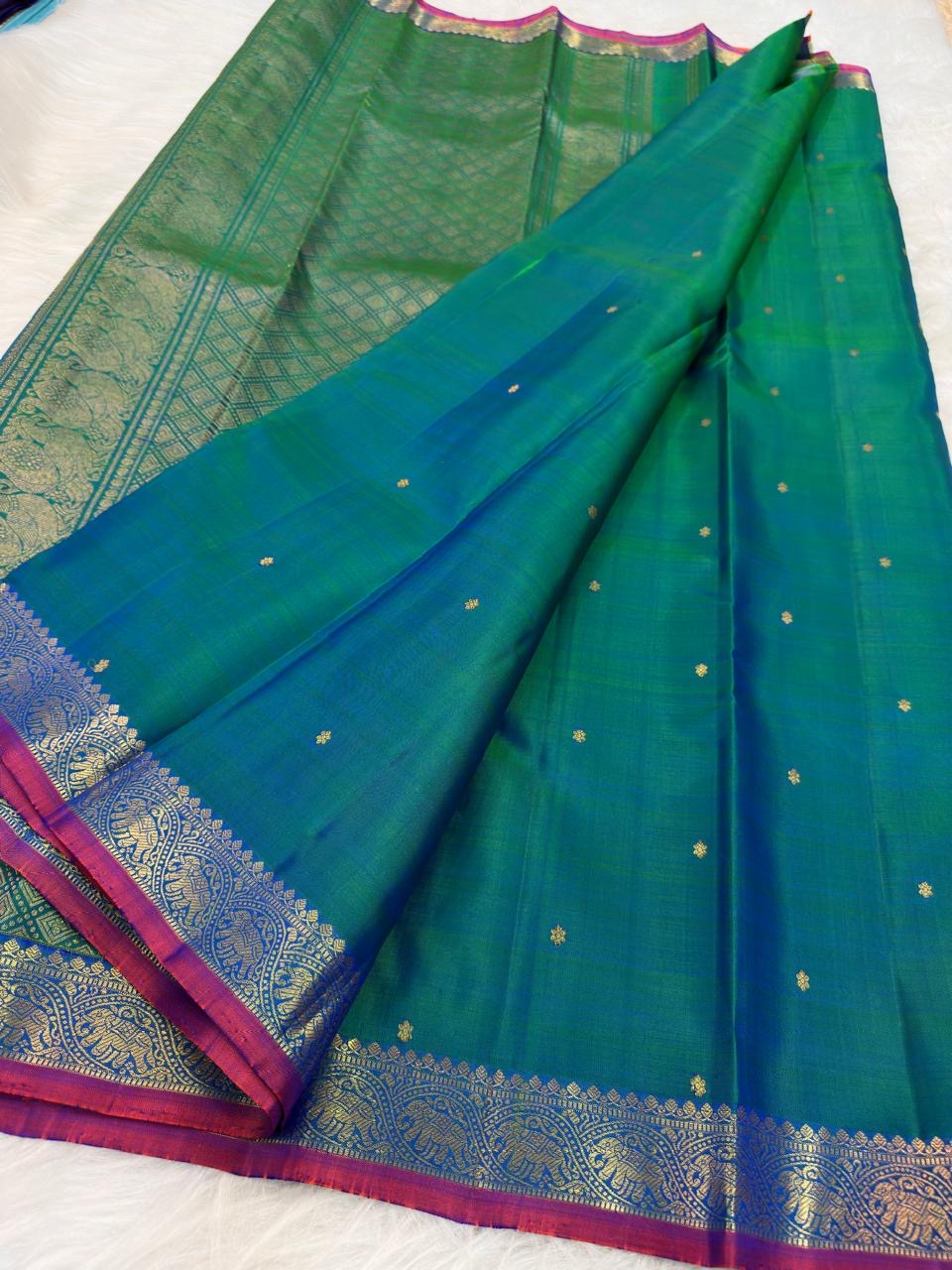Peacock Blue Handwoven Pure Silk KanchiPattu Saree with Small Gold Buttas & Petite Zari Elephant Border