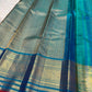 Close view of antique-gold zari border on radiant Sapphire Blue Kanchipuram silk.