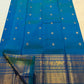 Peacock Blue silk saree with spaced gold zari buttas.