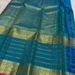 Handwoven Mayil Kazhuthu Varisaipet saree with layered traditional antique-gold border.