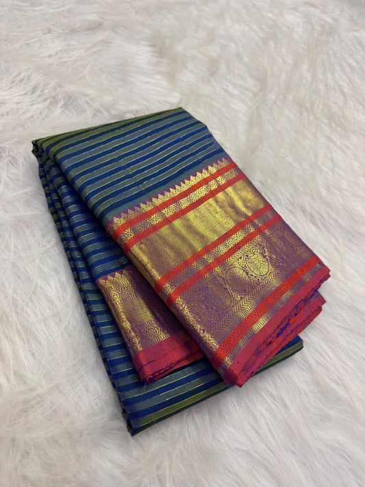 Close view of the peacock blue and deep green with fine gold zari stripes body with needle-fine Vairaoosi stripes and zari threads.