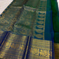 Traditional Annam motifs in framed antique-gold zari panels on Mayil Kazhuthu Kanchipuram silk