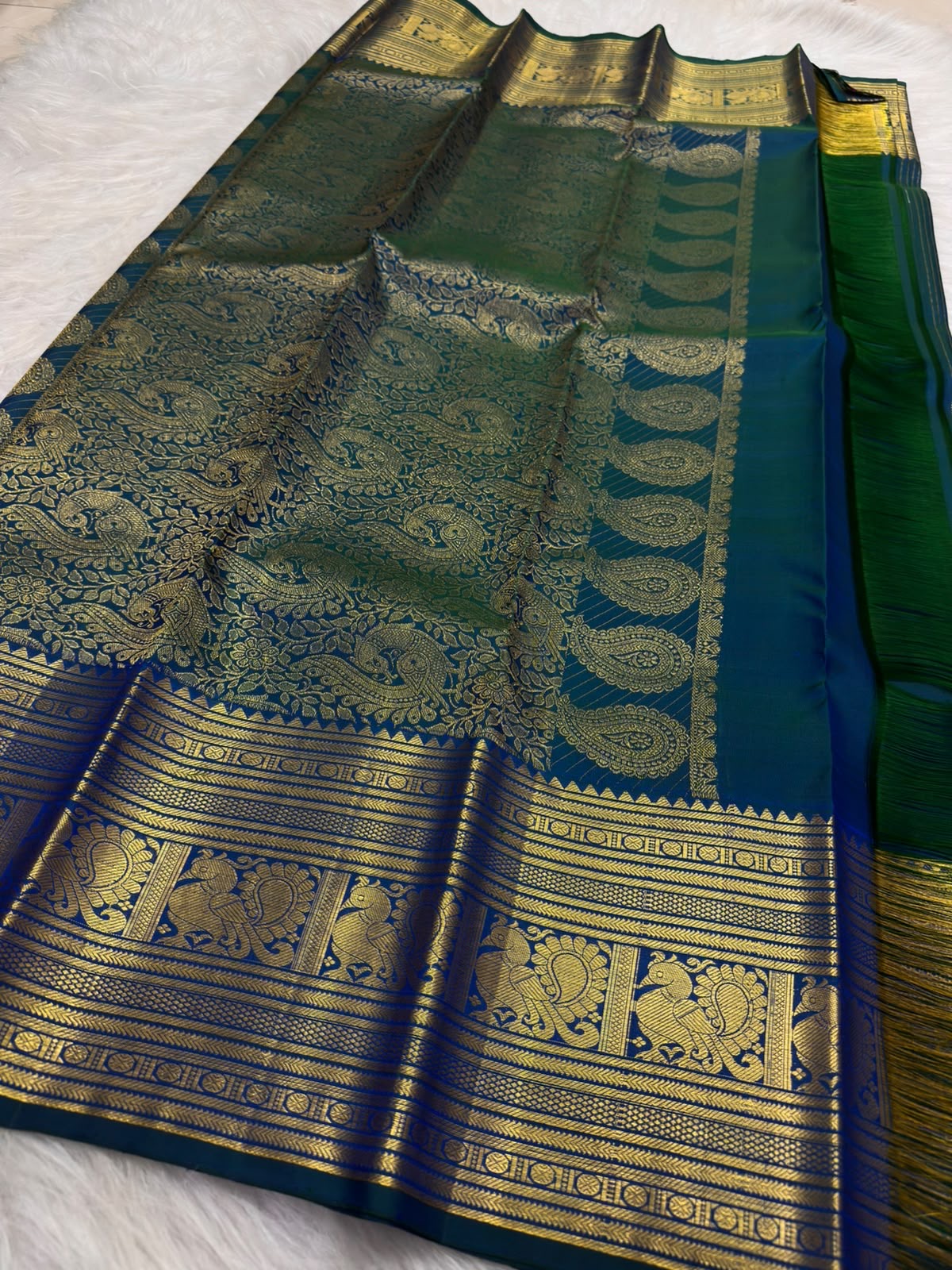 Traditional Annam motifs in framed antique-gold zari panels on Mayil Kazhuthu Kanchipuram silk
