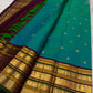 Peacock Blue-Green shot-colour Kanchipuram silk with petite zari buttas and elaborate multi-register border.