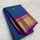 Peacock Blue Handwoven Pure Silk Kanchipuram Saree with Petite Zari Buttas and Magenta Gold Border