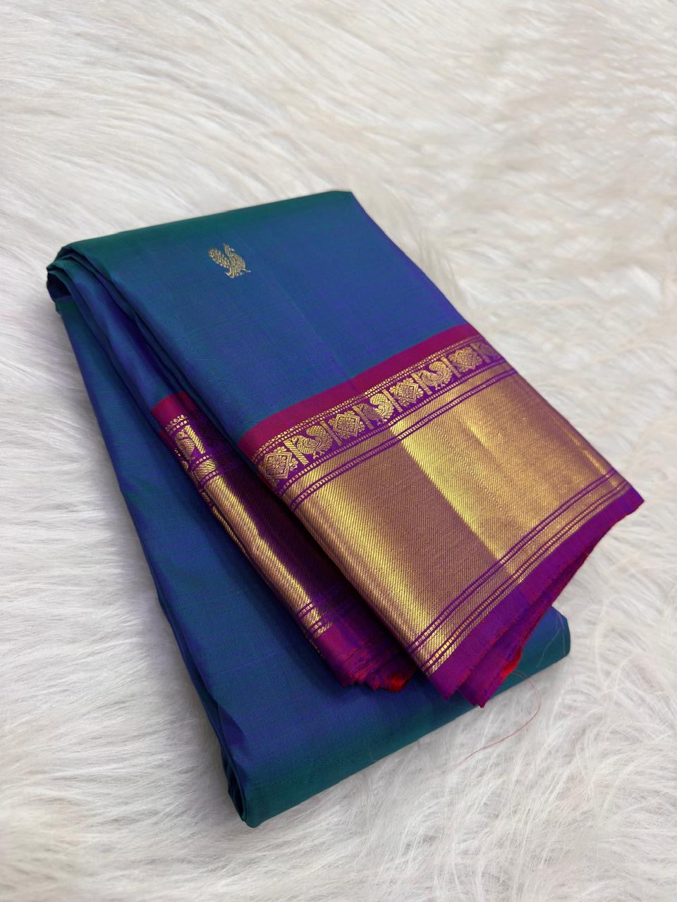 Peacock Blue Handwoven Pure Silk Kanchipuram Saree with Petite Zari Buttas and Magenta Gold Border