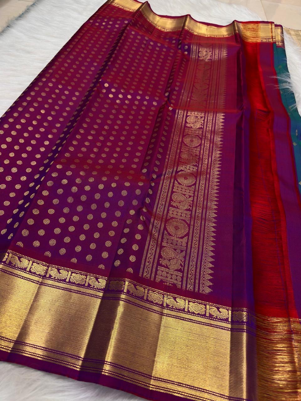 Peacock Blue Handwoven Pure Silk Kanchipuram Saree with Petite Zari Buttas and Magenta Gold Border