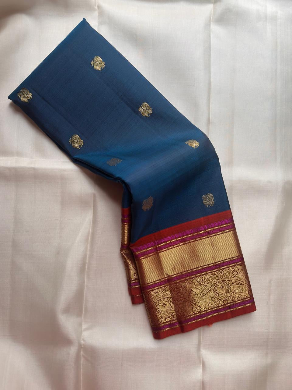 Peacock blue pure silk Kanchipuram saree with gold zari Butta motifs, full drape view