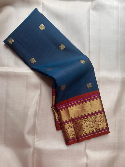 Peacock blue pure silk Kanchipuram saree with gold zari Butta motifs, full drape view