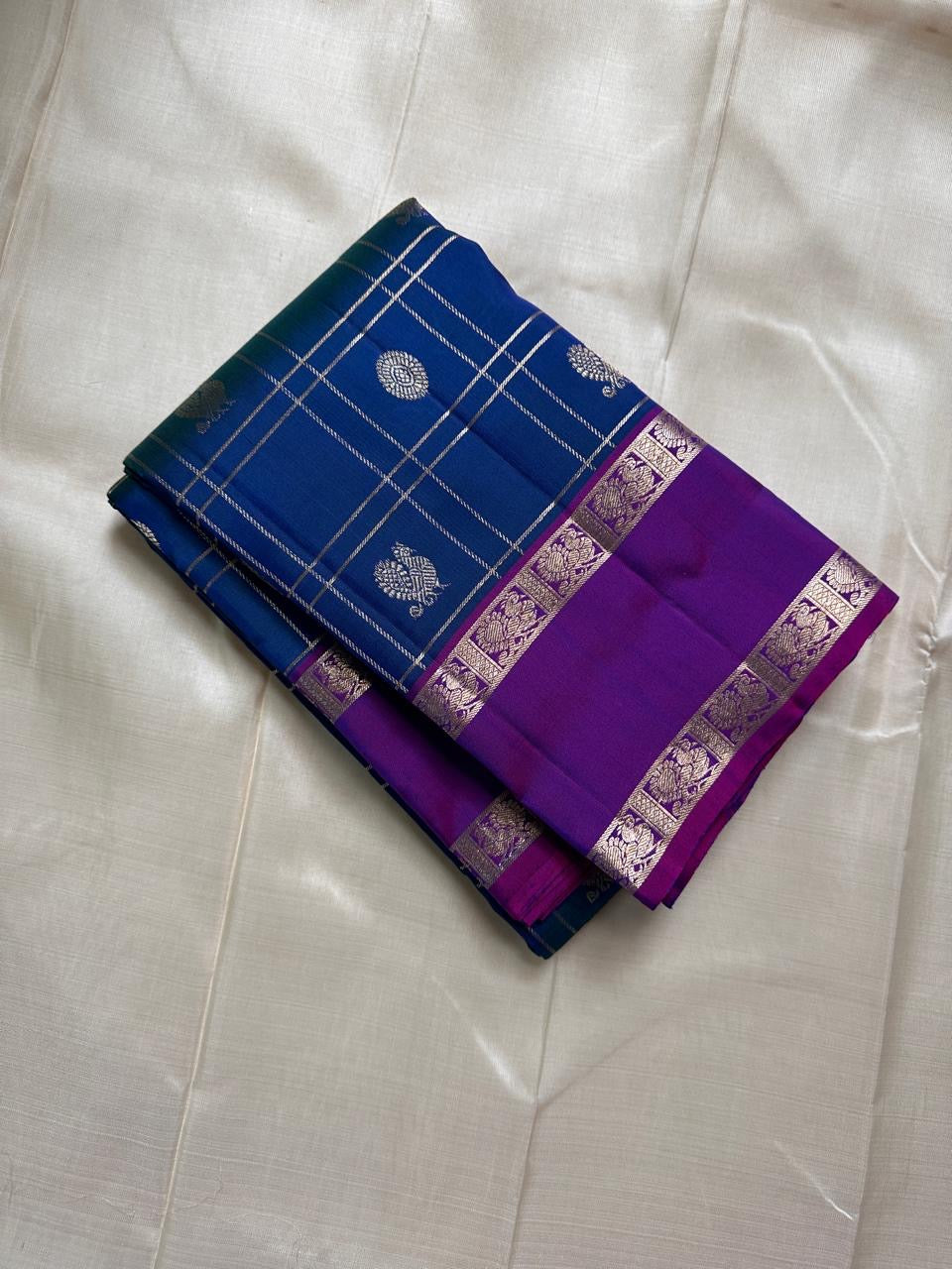 Peacock-blue Pure Silk Kancheepuram Rettapet saree with Kathiripoo-purple border and warm gold zari.
