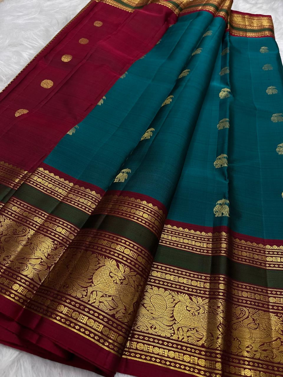Peacock Blue and Maroon Handwoven Pure Silk Kancheepuram Saree with Maanga Butta and Gandaberunda Border