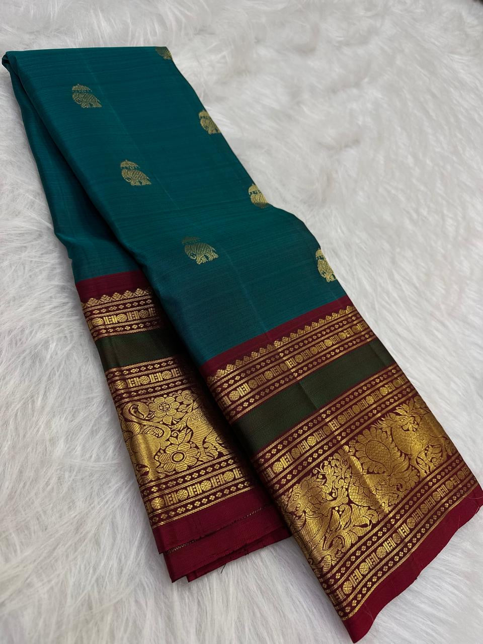Peacock Blue and Maroon Handwoven Pure Silk Kancheepuram Saree with Maanga Butta and Gandaberunda Border