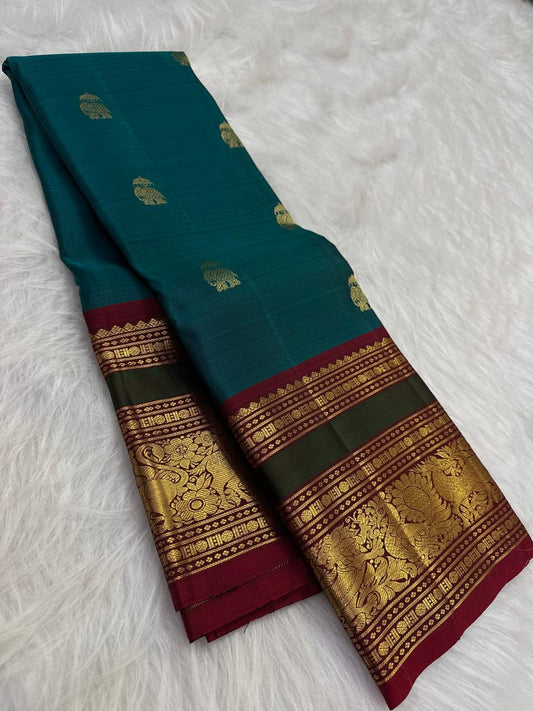 Peacock Blue and Maroon Handwoven Pure Silk Kancheepuram Saree with Maanga Butta and Gandaberunda Border