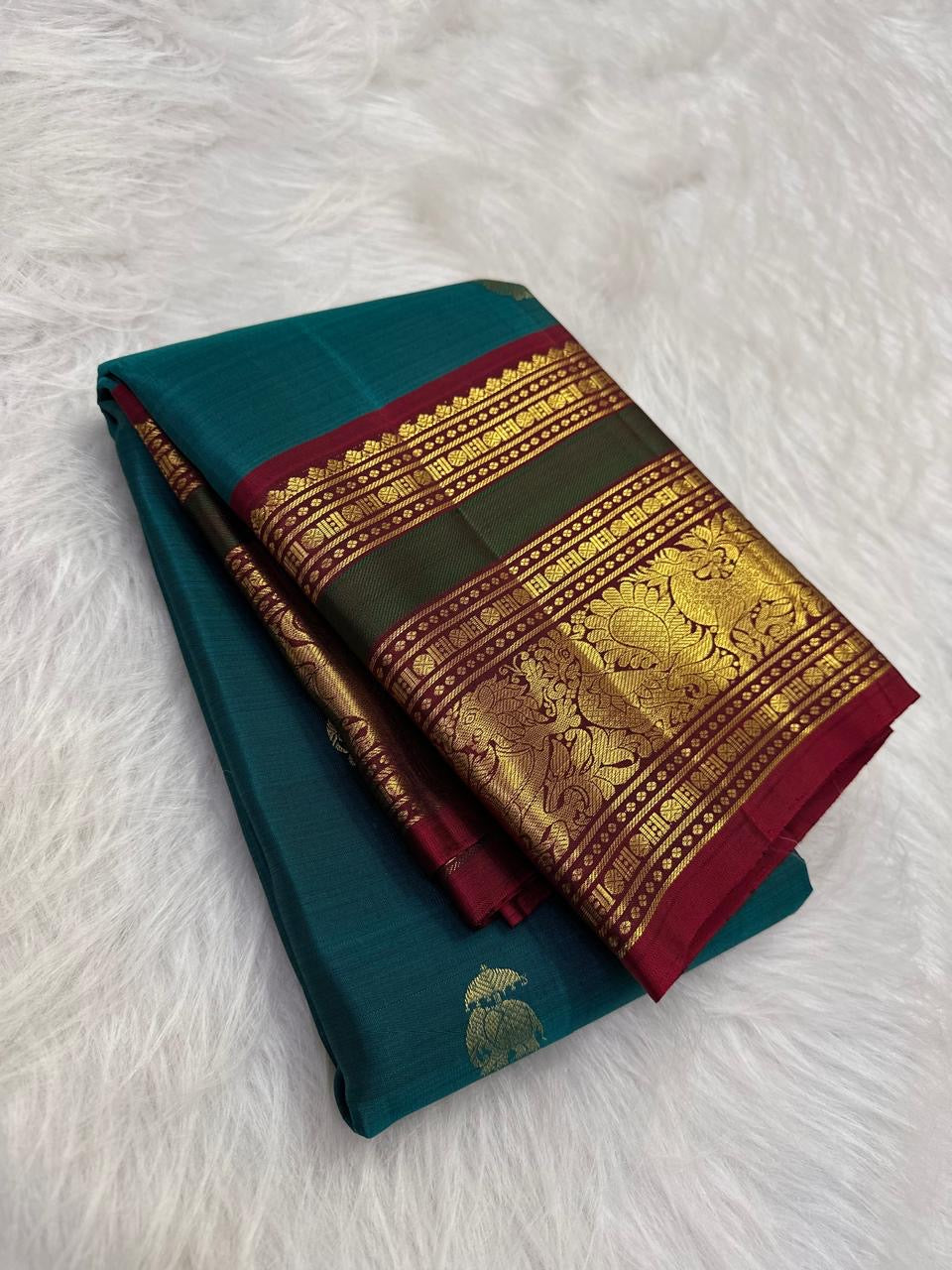 Peacock Blue and Maroon Handwoven Pure Silk Kancheepuram Saree with Maanga Butta and Gandaberunda Border